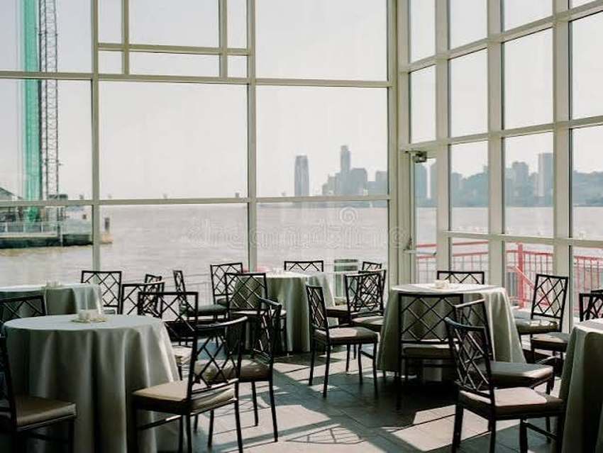 Restaurant dining room with a city skyline view